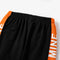 orange white and black color t-shirt and pants